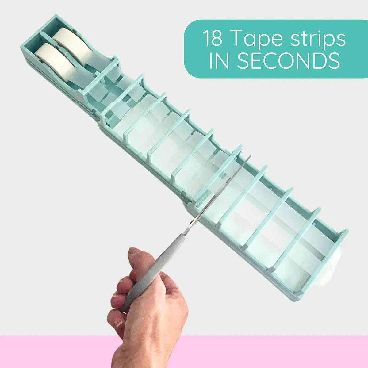 Scissors cutting prepared tape strips across the dispenser guides