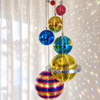 Mirrored planet spheres casting colorful reflections