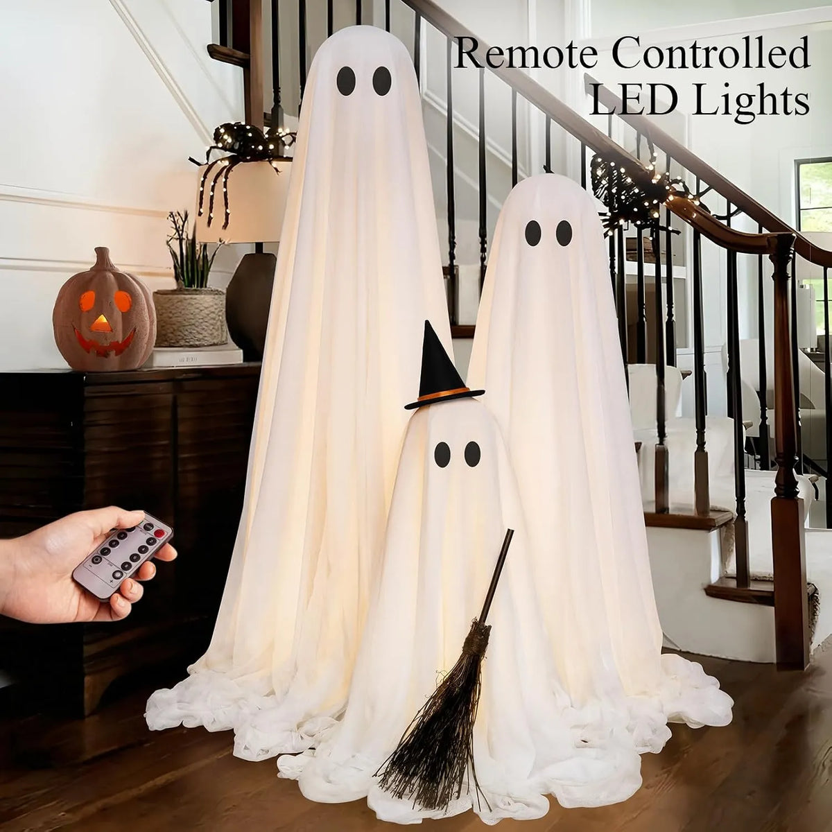 Remote-controlled warm LED lights inside the three standing ghosts
