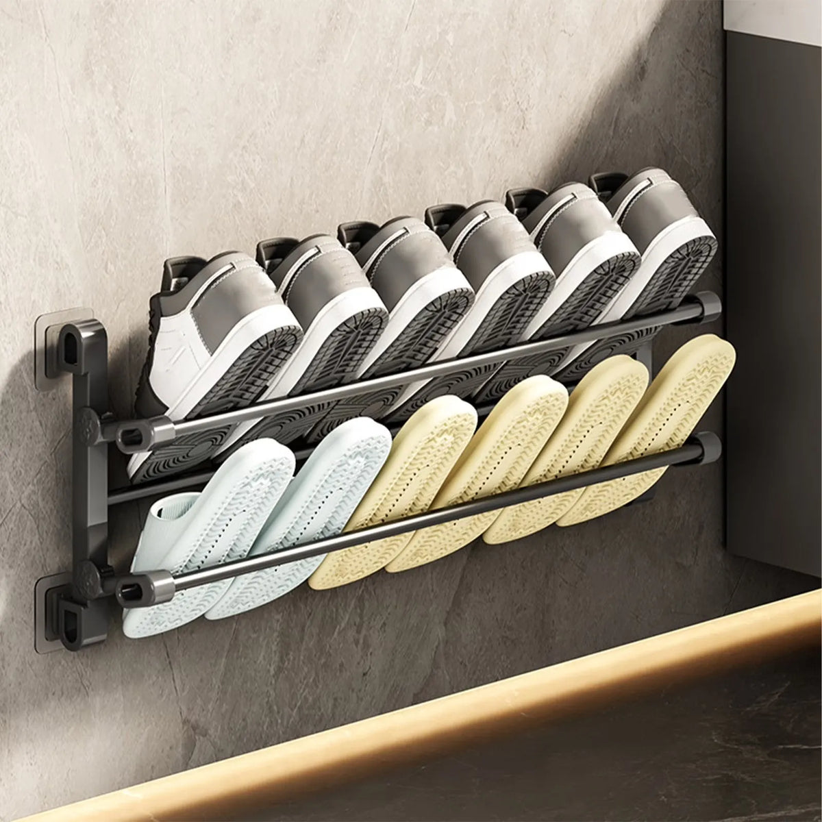 Black two-tier wall-mounted shoe rack holding everyday footwear