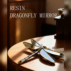Dragonfly mirror on a sunlit wood table