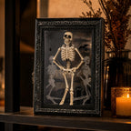 Skeleton picture frame on a warm candlelit mantel