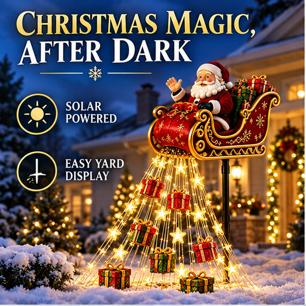 Solar Santa sleigh cascade glowing in a snowy front yard after dark