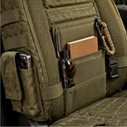 Close view of the green seat protector pockets, webbing, mesh, and side buckle